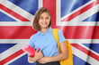 © New Africa - Happy student with backpack and notebook against flag of United Kingdom. Language school