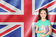 © New Africa - Little girl with notebooks against flag of United Kingdom. Language school