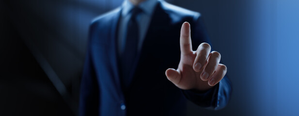 Businessman pressing button on virtual screen, Innovation and Digital Touch Interaction on Futuristic Technology Interface.