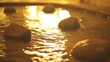 © Abul - Calming golden water flowing around stones, creating a serene atmosphere, spa like