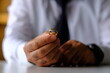© Gkhan - wedding ring on a divorced man's hand