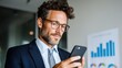 © pornthip - Man holding cell phone man in suit holds cell phone professional context man holding