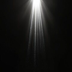 Wall Mural - Bright white light beams shine down from above on deep black background. Countless tiny sparkling dust particles fall through intense volumetric light rays. Creates magical ethereal atmospheric