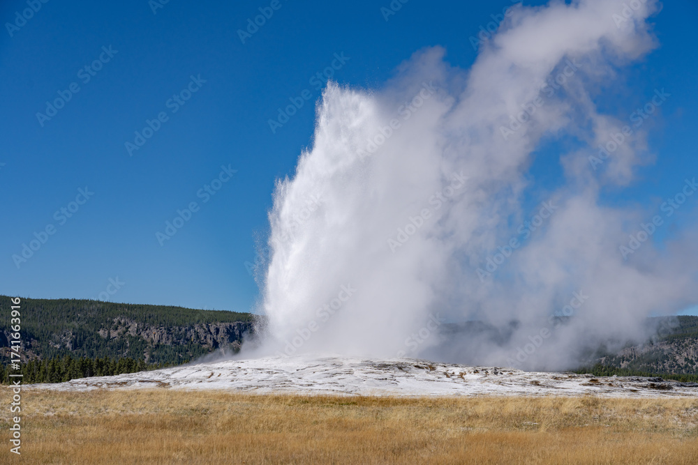 Old Faithful is a cone geyser in Yellowstone National Park in Wyoming ...