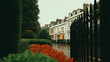 © Moustafa - Classic London townhouse row with white stucco and black iron fences, overcast lighting