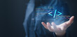 © Garun Studios - Close-up of a hand with a floating HTML code symbol and digital programming lines, representing software development, coding, web engineering, and innovative technology solutions.