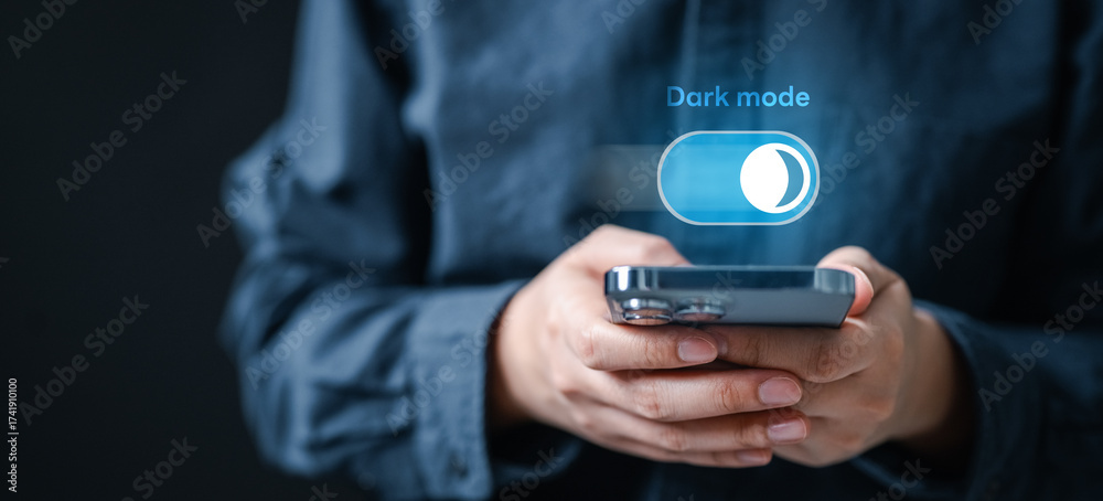Minimalist concept of a person holding a smartphone with dark mode ...