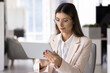 © fizkes - Focused Latin CEO woman in glasses typing on digital tablet