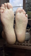 © Iuliia - Close-up of two male feet with clean, well-groomed soles. The skin appears healthy and smooth, suitable for foot care and pedicure treatments.