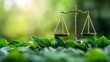 © Eakanan - A golden balance scale rests on lush green leaves symbolizing environmental justice and ecological balance
