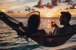 © NAPHAT - Romantic Sunset: A couple share an intimate moment of relaxation, sipping drinks while resting in a hammock, enjoying the warm hues of the sunset over the calm ocean.