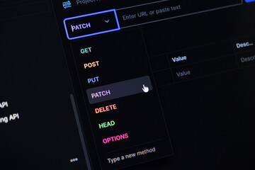 Dark mode API development interface on a screen, showing the HTTP PATCH method selection for web services, modern backend programming, and digital workflow
