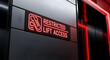 © Dinda - Illuminated Lift Access Designation In Modern Building Illuminated By Red Light And Design