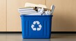© AlfaSmart - Office recycling bin with paper and documents for eco-friendly waste management in workplace environment