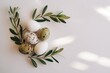 © fatemaakter - Easter Eggs and Olive Branch: A collection of colorful eggs rests beside an olive branch, embodying the renewal of life, with a peaceful and elegant atmosphere.
