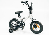 Isolated childrens bicycle with side wheels on white background