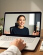 © Aliaksandr Barouski - Woman on video call greets client from modern home office