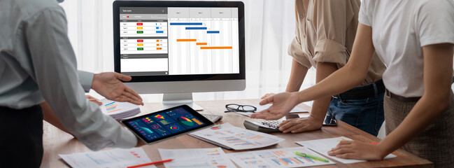 Wall Mural - Project planning software for brisk business project management on the computer screen showing timeline chart of the team project