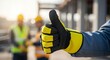 © MR.DEEN - A Construction Worker Giving a Thumbs-Up on a Job Site for Great Teamwork, Job Well Done, A Sign of Approval and Success