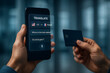 © Jairo - Smart Translation: Hands delicately hold a sleek smartphone displaying a real-time translation application, next to a credit card.