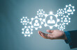 © Nirusmee - Human resources, A hand holding a digital sphere with human figure models inside.