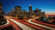 © Yohanessoekamti - Dynamic Metropolitan Cityscape with Streaking Vehicle Light Trails at Dusk