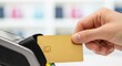 © WisChi - Hand inserts golden credit card into payment terminal Transaction Purchase