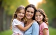 © shu - Portrait of beautiful mother with two daughters outdoors. High quality