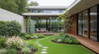 © Iza - A modern house with a beautiful garden featuring a stone path, lush greenery, and a wooden deck, creating a serene and inviting outdoor space