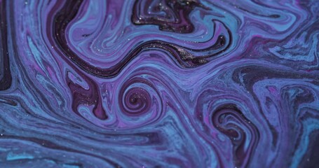 Wall Mural - Enamel ink. Swirling art. Defocused blue purple colorful flowing liquid dark black stains twirling on abstract creative background.