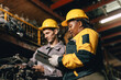 © Quality Stock Arts - African women with engineer man staff worker working heavy industry old part warehouse