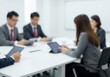 © Andrew - Blurred abstract background of a business team meeting in a modern conference room.