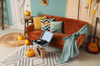 © Pixel-Shot - Interior of stylish living room with sofa, record player and pumpkins