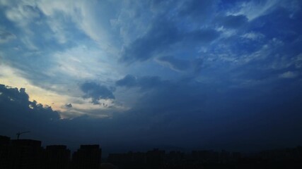 Wall Mural - Time lapse of sunset clouds before a thunder-storm