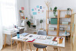 © Westend61 - Modern creative home office workspace with plants and organized shelves