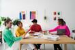 © Studio Marmellata - Group of colleagues working on project in office
