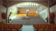 © JuroStock - A large auditorium with rows of orange chairs and a red umbrella in the background