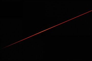 Wall Mural - red laser light against a dark backdrop