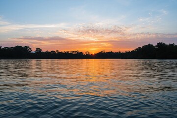 Wall Mural - sunset over the water surface