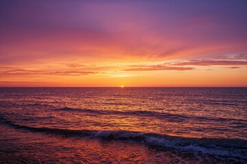 Wall Mural - ocean at dusk with colorful twilight sky