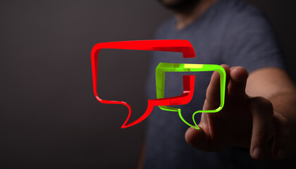 Conceptual communication image showcasing a man's hand interacting with luminous speech bubbles for messaging and interaction.