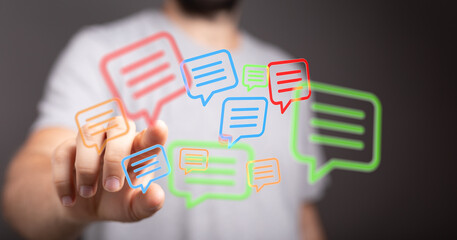 Illustration of a man touching colorful communication bubbles, symbolizing modern digital messaging and connectivity.