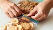 © Ksenia - Mom sealing school snack bags in soft indoor light with caring close-up of hands and food details
