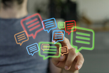 A man touching floating message symbols illustrating digital communication, notifications, and social networking, conveying the idea of digital