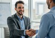 © Andrew - Successful Business Deal - Two Men Shaking Hands in Office.
