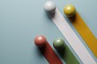 © Davide Illini/Stocksy - Abstract 3D balls with colorful diagonal bars on blue background