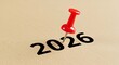 © ArpiIslam7777 - Red pushpin secures year 2026 cutout signaling future goals and planning ahead