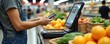 © Viktor - Customer pays for groceries at supermarket self checkout using smartphone app. Person scans items and makes payment via mobile tech. Fast convenient shopping at retail store.