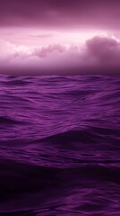 Canvas Print - Smooth Purple and Black Gradient Ocean with Dramatic Clouds Above