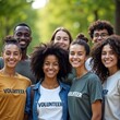 © Fatima - Group of smiling young volunteers outdoors in casual clothes, teamwork and community support concept, on green park background,